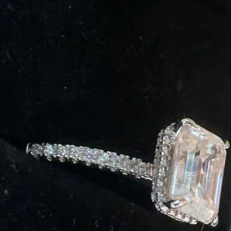 One piece of S925 sterling silver eternity ring set with a cushion-cut moissanite ranging from 1 to 4 carats, perfect for a wedd